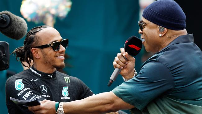 Embracing LL Cool J on the grid prior to the 2023 Grand Prix of Miami. Photo: Chris Graythen/Getty Images