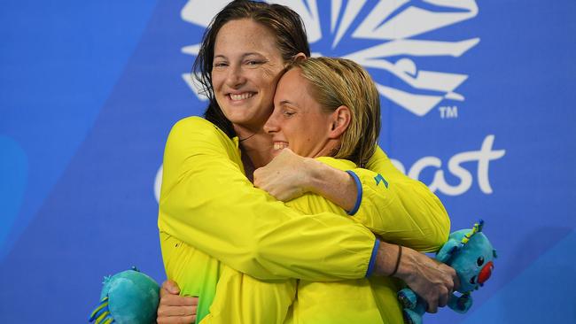 Cate Campbell hugs Bronte Campbell during the 2018 Gold Coast Commonwealth Games.   AFP PHOTO / MANAN VATSYAYANA