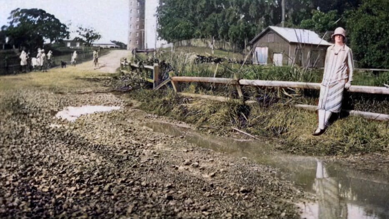 Brought back to life in colour, this image shows a woman standing in East Bundaberg, possibly around the 1920s. An exact date is unknown. Photo: Bundaberg Regional Libraries.