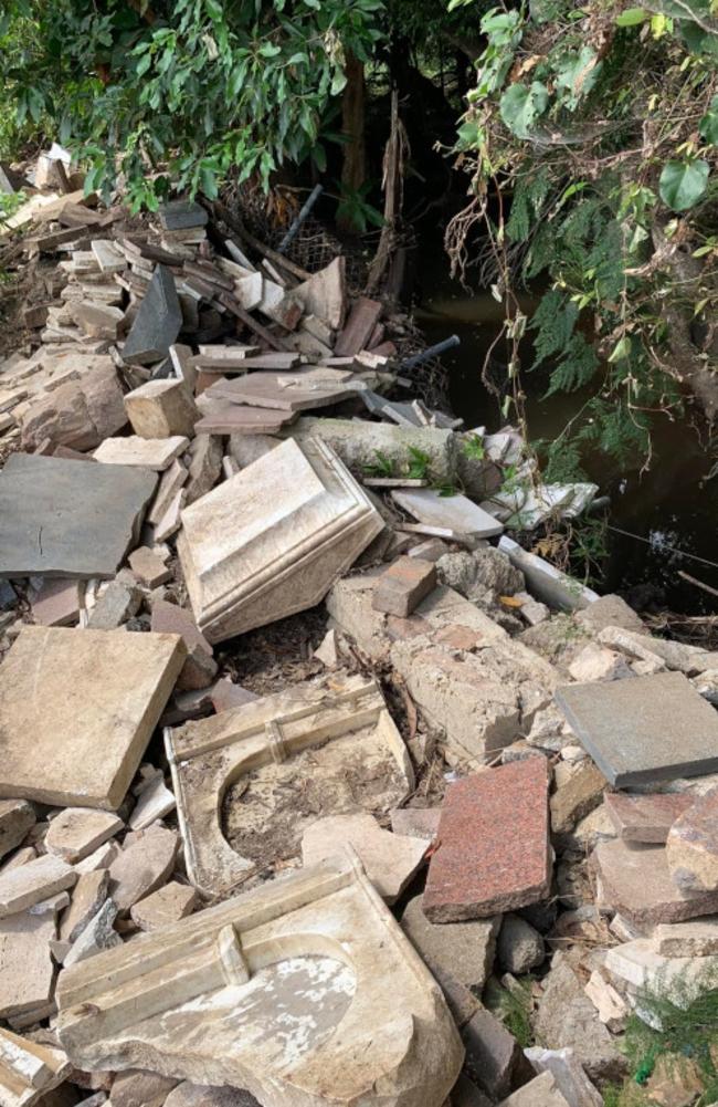 The scene of the lost headstones following the 2022 Brisbane floods. Picture: Christopher Dawson/Time Travel Club