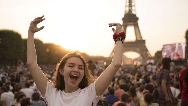 A young woman outside the Eiffel Tower. Picture: TwT company