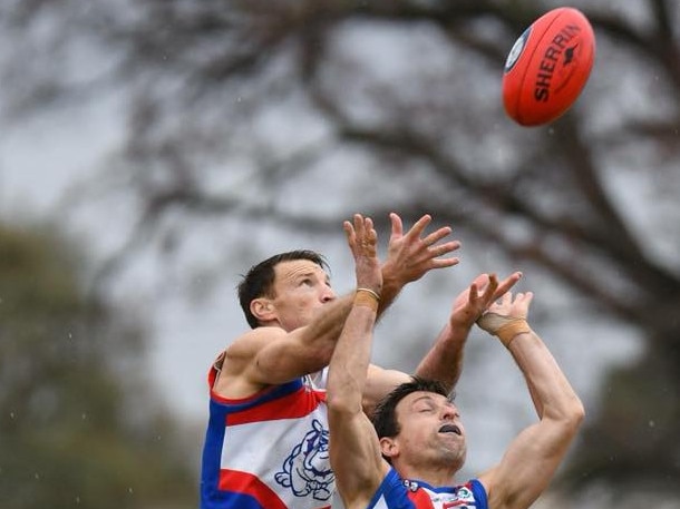 Brent Harvey flies for a mark. Picture: Nathan William Media