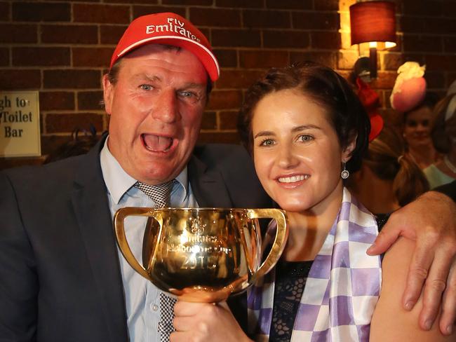 Michelle Payne and trainer Darren Weir celebrate with the Cup. Picture: Yuri Kouzmin