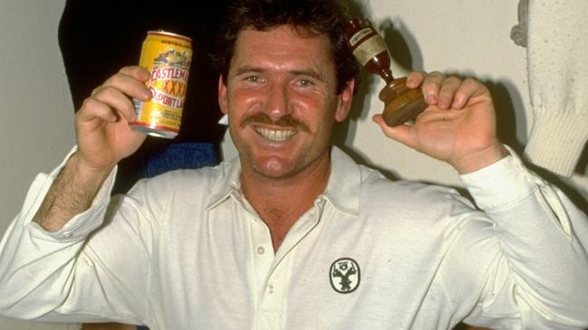 Australia captain Allan Border of Australia holds up the urn his team won in 1989.