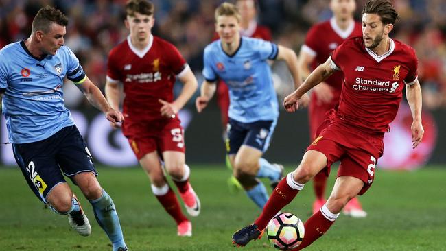 Adam Lallana controls the ball against Sydney FC opponents last night.