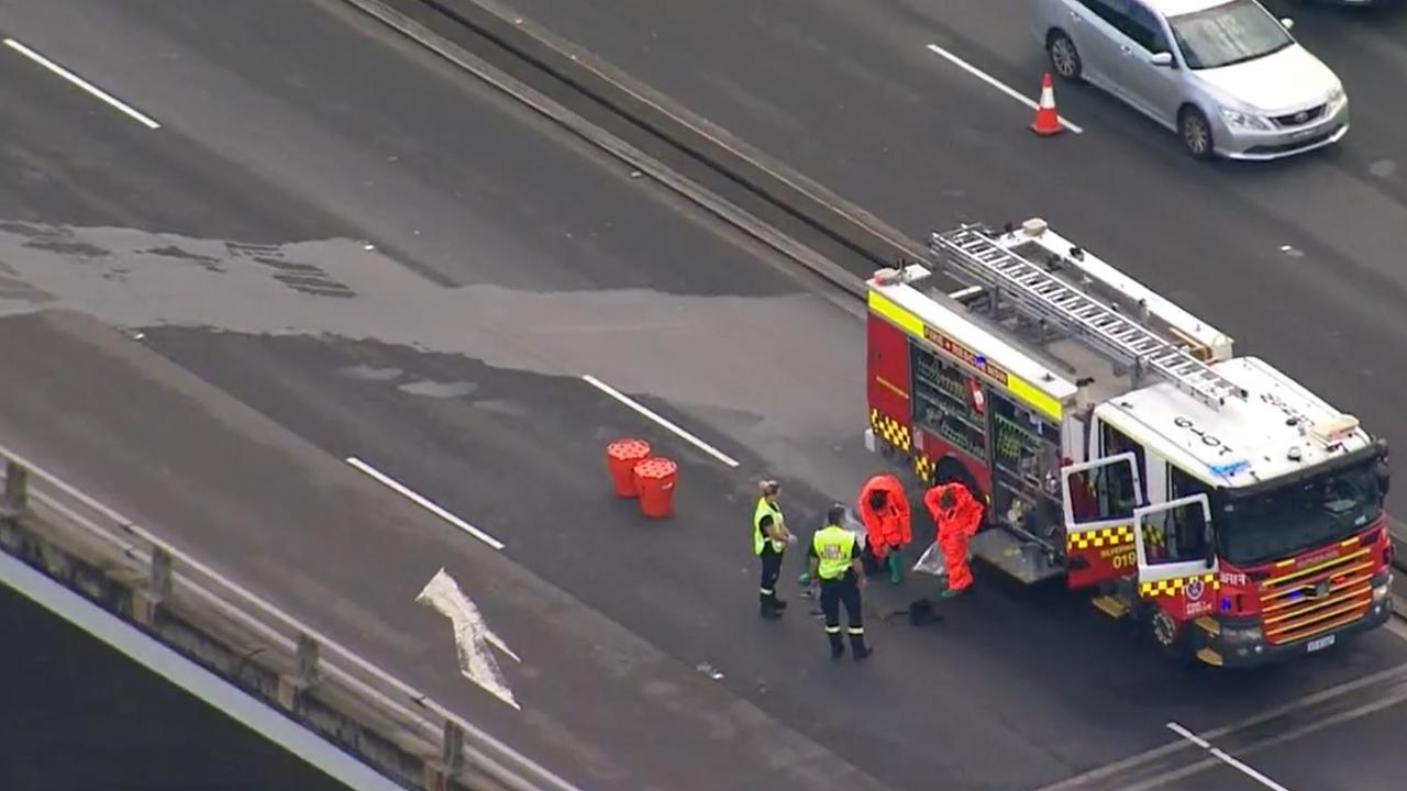 Specialised chemical response fire crews dressed in hazmat suits to clean up the chemical spill. Picture: 9 News