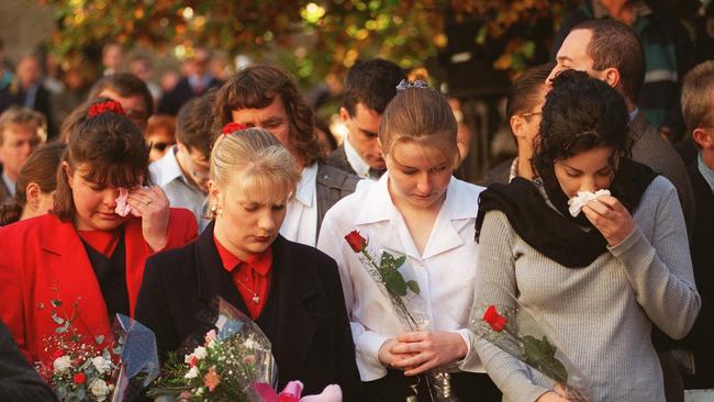 Mourners presenting flowers at a service at St David's Cathedral, Hobart in memory of 35 people killed and 20 injured at Port Arthur on April 28, 1996.