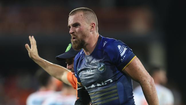 DARWIN, AUSTRALIA - APRIL 19:  Clint Gutherson of the Eels is attended to by a trainer after an injury during the round seven NRL match between Parramatta Eels and Dolphins at TIO Stadium on April 19, 2024, in Darwin, Australia. (Photo by Mark Metcalfe/Getty Images)