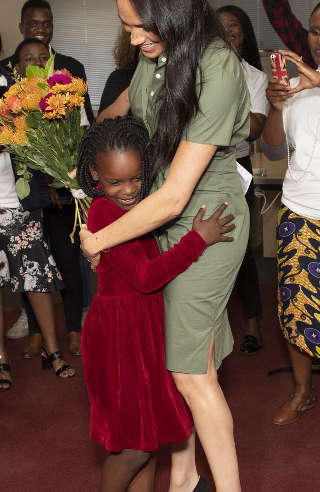 Meghan, Duchess of Sussex is presented flowers by Luyanda, age 8, in South Africa. Picture: Getty