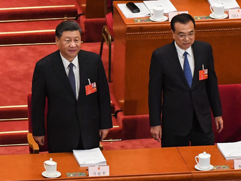 Chinese President Xi Jinping (L) and Premier Li Keqiang (R) arrive for the opening session of the National People’s Congress (NPC) at the Great Hall of the People in Beijing. Picture: Leo Ramirez/AFP