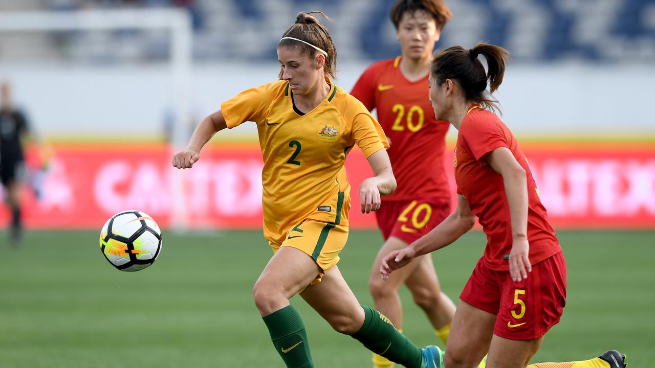 The Matildas’ Amy Harrison pushes past an opponent at GMHBA Stadium on November 26, 2017. Picture: AAP Image/Joe Castro.