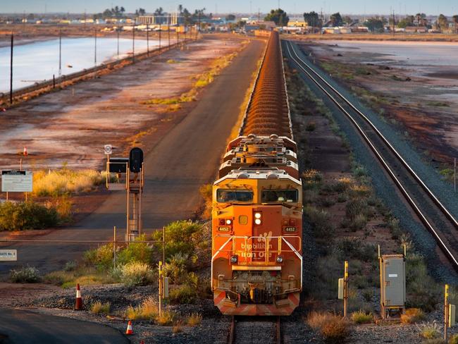 A BHP freight train carries Australia’s trump card, iron ore, to port. Picture: Ian Waldie/Bloomberg News