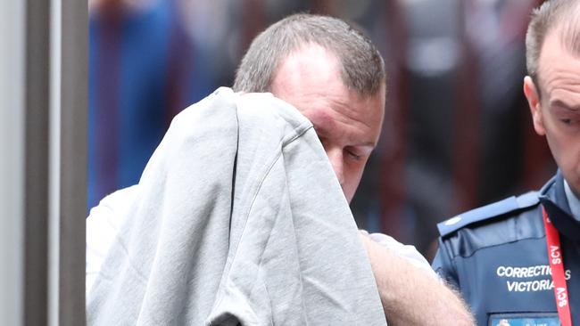 Scott Murdoch is taken into the Victorian Supreme Court in Melbourne. Thursday, August 8, 2019. Scott Murdoch has admitted he murdered a Melbourne mother found bleeding to death by her young daughters six years ago. (AAP Image/David Crosling) NO ARCHIVING