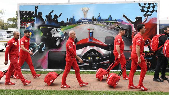 Members of the Ferrari team packing up their equipment at Albert Park. Picture: AFP