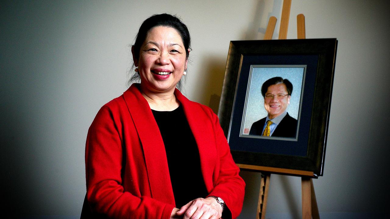 Margaret Lee with a special embroidered portrait of Hieu Van Le especially designed by curator of Silk Legacy Exhibition. Picture: Mike Burton