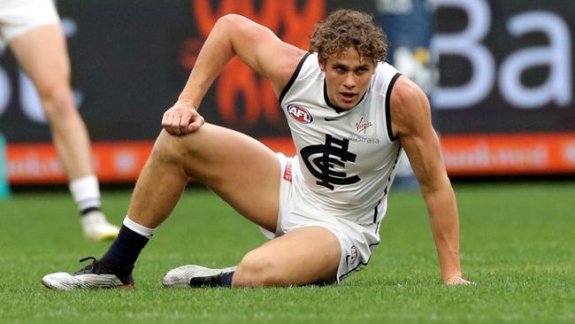 Charlie Curnow clutches his knee after being injured in the first quarter of Sunday’s game. Picture: AAP Image