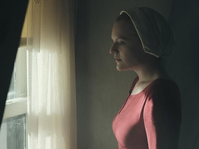 The Handmaid's Tale  -- "Offred" Episode 101 --  Offred, one the few fertile women known as Handmaids in the oppressive Republic of Gilead, struggles to survive as a reproductive surrogate for a powerful Commander and his resentful wife. Offred (Elisabeth Moss), shown. (Photo by: George Kraychyk/Hulu)