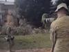 Infuriating moment army pose for flood pic