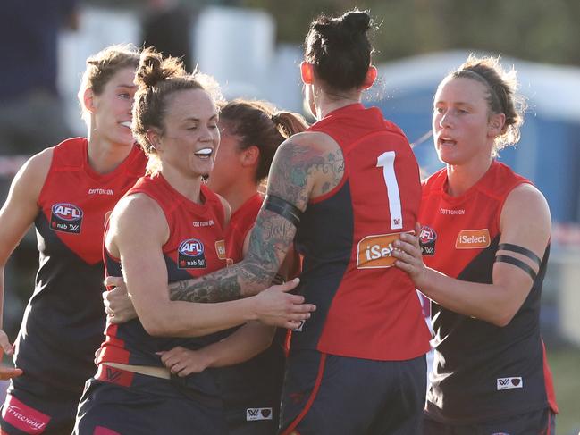 Demons celebrate after Daisy Pearce scores  a goal during the Round 5 AFLW match between the Melbourne Demons and the Brisbane Lions at Casey Fields in Melbourne, Friday, March 2, 2018. (AAP Image/David Crosling) NO ARCHIVING, EDITORIAL USE ONLY