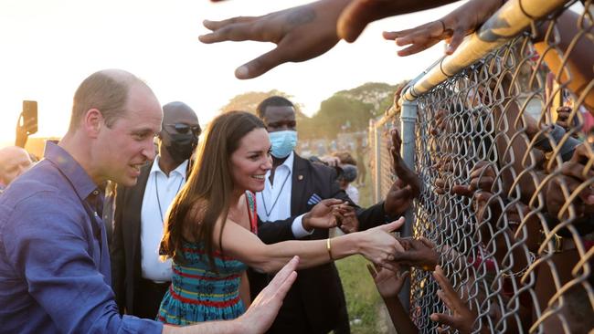 William and Kate shake hands with children during a visit to Trench Town, Jamaica. Picture: Chris Jackson-Pool/Getty Images.