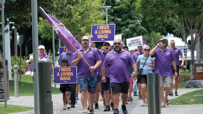 A protest of Lotus Glen Correctional Centre staff and their families as well as Together Union members marched on Cook MP Cynthia Lui's office in the Cairns CBD on December 1, 2021. The march was led by Lotus Glen employees John Burley (left) and Basil Kidu (right).