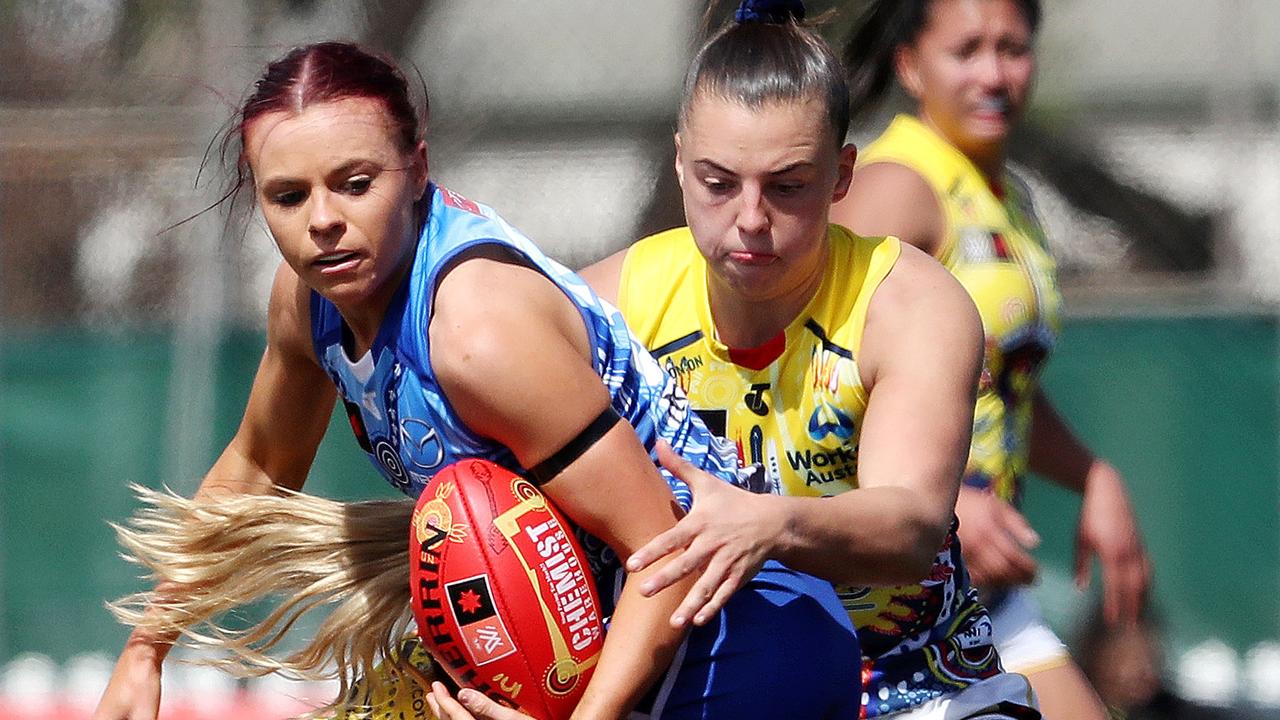 Jenna Bruton is under pressure from Ebony Marinoff at Unley Oval in Adelaide.