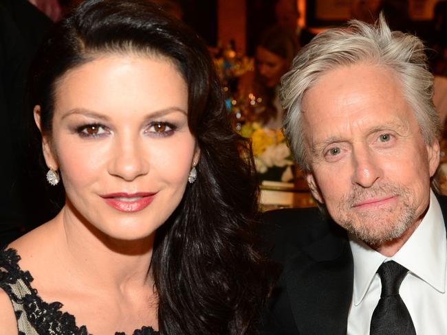 HOLLYWOOD, CA - JUNE 05: Actors Catherine Zeta-Jones (L) and Michael Douglas attend the 2014 AFI Life Achievement Award: A Tribute to Jane Fonda at the Dolby Theatre on June 5, 2014 in Hollywood, California. Tribute show airing Saturday, June 14, 2014 at 9pm ET/PT on TNT. (Photo by Frazer Harrison/Getty Images for AFI)