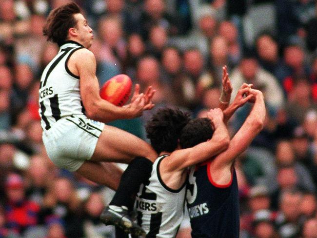 Alex McDonald flies for a mark in his Collingwood days.