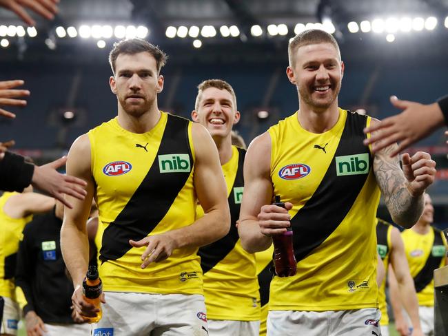 MELBOURNE, AUSTRALIA - AUGUST 20: Nathan Broad (R) and Noah Balta of the Tigers (L) leave the field during the 2022 AFL Round 23 match between the Essendon Bombers and the Richmond Tigers at the Melbourne Cricket Ground on August 20, 2022 in Melbourne, Australia. (Photo by Dylan Burns/AFL Photos via Getty Images)