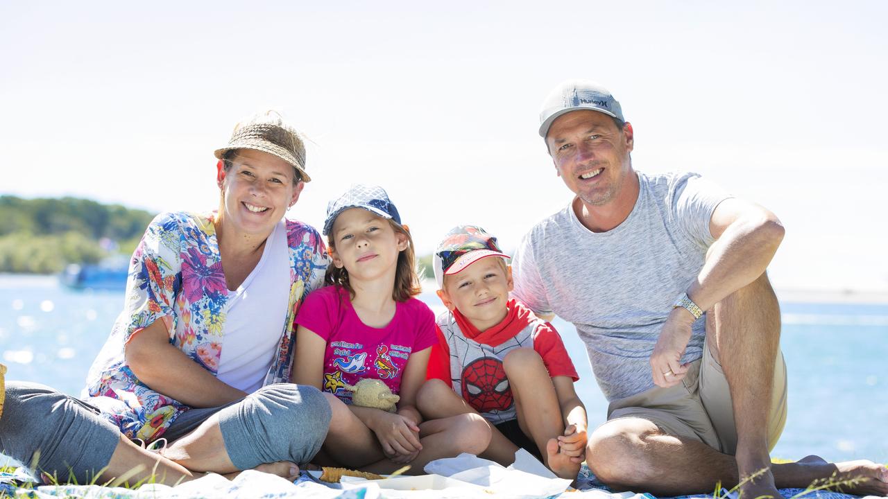 Danielle and Andrew Miles enjoy a picnic on the Noosa River with children Airlie 7, and Toby 5. Picture: Lachie Millard