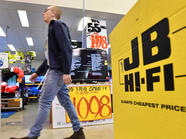 A retail sales assistant is seen inside a JB Hi-Fi store in Brisbane, Monday, August 13, 2018. JB Hi-Fi's full yet net profit jumps 35 per cent to $232.2 million, thanks to strong demand for its consumer electronics. (AAP Image/Darren England) NO ARCHIVING