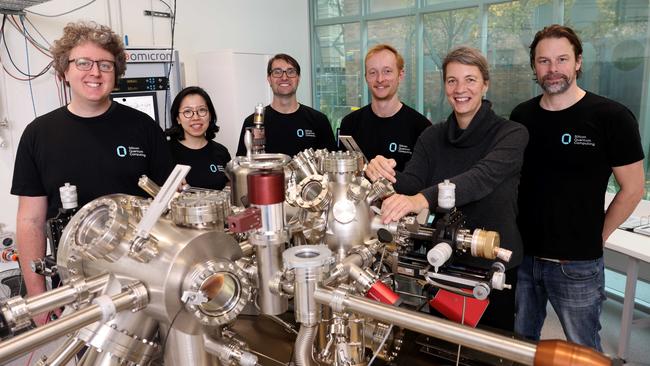 Michelle Simmons pictured with some of her team, from left: Sam Gorman, Yousun Chung, Mitchell Kiczynski, Matt Donnelly and Joris Keizer in the quantum mechanics lab at NSW Uni. Picture: NCA NewsWire / Damian Shaw