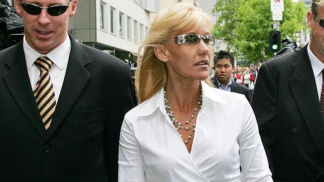  NOVEMBER 4, 2004: Melbourne teacher Karen Ellis (C) leaves the Victorian County Court with her husband Stephen Ellis (R) and...