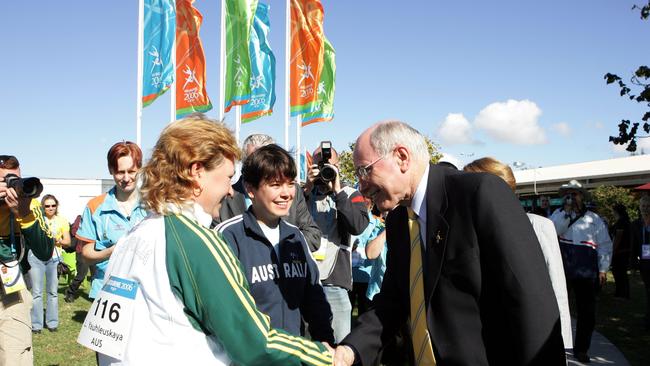 Dina Aspandiyarova, middle, meets PM John Howard after winning gold at the Commonwealth Games Melbourne.