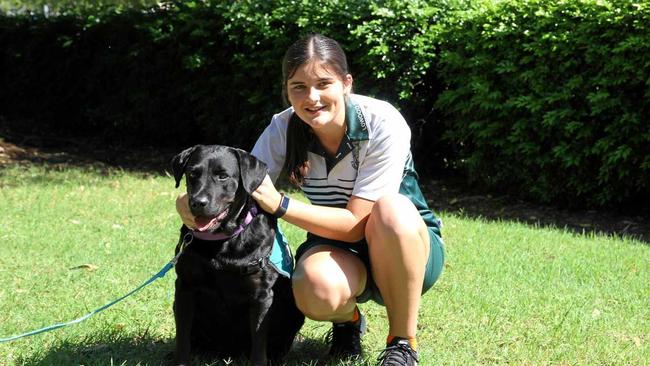 STUDENTS' BESTFRIEND: Lowood State High School student Sophie, with the school's beloved assistance dog, Jackson. Picture: Dominic Elsome