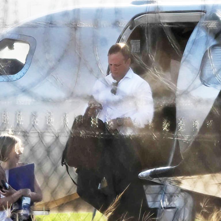 Premier Steven Miles and staff exit a private jet, VH-VKX, at the Government Air Wing, Brisbane Airport. Picture: Lyndon Mechielsen/Courier Mail