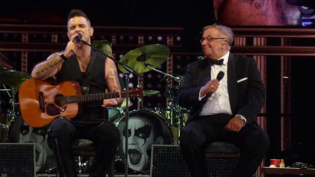 Hey dad ... Robbie Williams sings Better Man with father Pete Conway. Picture: Melissa Reed TTM