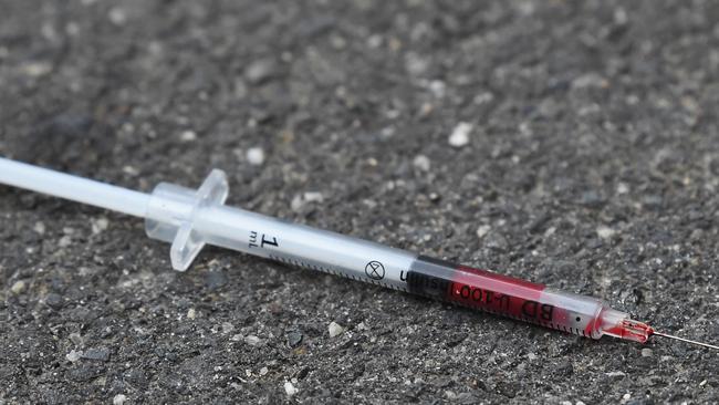 A blood-filled needle in a Richmond laneway, one week after the injecting room opened. Picture: Nicole Garmston