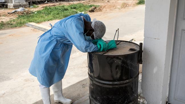 A hygienist rests in a COVID-19 treatment centre in Dakar, Senegal. Picture: AFP