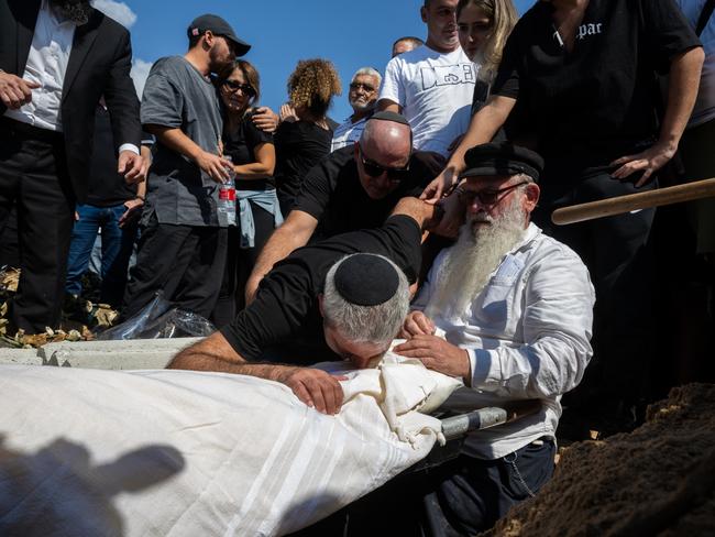 The father of Naor Hassidim, 22, who was killed with his girlfriend during the attack on kibbutz Kfar Aza, grieves during his burial during the funeral in Ashdod, Israel. Picture: Alexi J. Rosenfeld/Getty Images