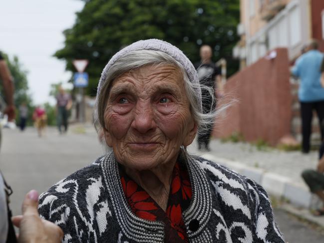 An elderly woman cries, because she can't find her dog in Kherson, Ukraine after shelling and the destruction of a dam that caused flooding. Picture: Getty Images