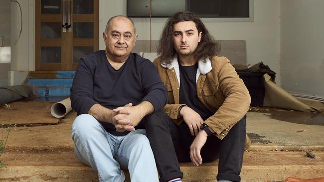 Omid Rad with son Aria at the incomplete townhouse in Myrtle Bank. Picture: Matt Loxton