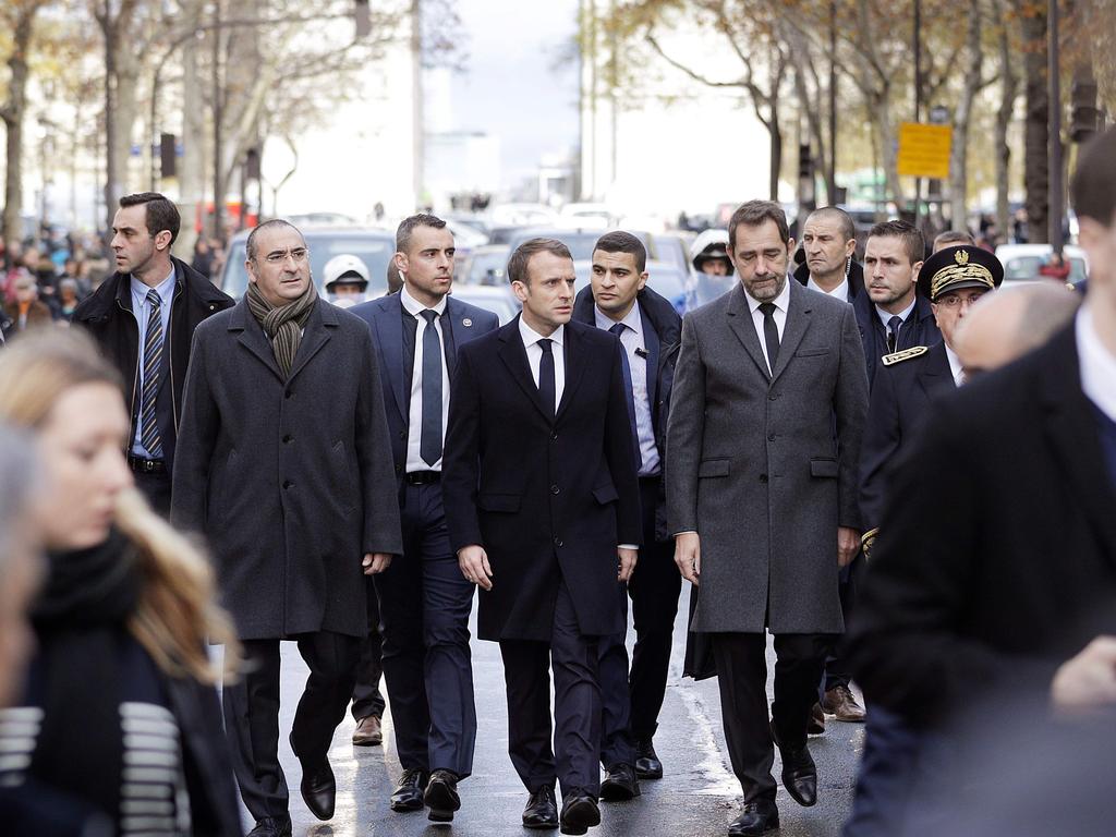 French President Emmanuel Macron flanked by his team at riot scenes in Paris. Picture: Geoffroy Van der Hasselt/AFP