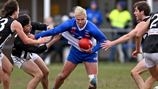 EDFL: Sunbury Kangaroos’ Nathan Carroll is surrounded by Fog. Picture: Andy Brownbill