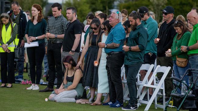 Kelly WilkinsonÃs  vigil memorial  at  Parkwood.  Sisters Emma Wilkinson (black dress), Natalie Wilkinson (on the ground), Danielle Carroll (white dress),  Kelly's dad Reg Wilkinson  and   Danielle Carroll's husband Reece Carroll (green shirt, glasses on head). Picture: Jerad Williams