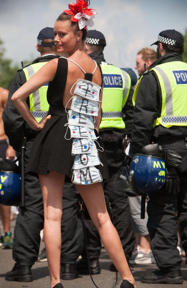 A woman wears a ‘freedom’ dress in Whitehall, London as the UK drops lockdown rules despite a surge virus cases caused by the Delta variant. Picture: Martin Pope/Getty Images