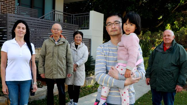 Hatice Oztan, Bing Sen Zhang, Maria Xu, Clement Lun his three-year-old daughter Tabitha and Barrie Browning at Sydney Olympic Park. Picture: Angelo Velardo