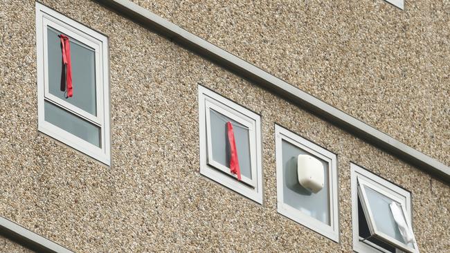 Red ribbons are seen in a window of the Flemington Towers. Picture: Getty Images.