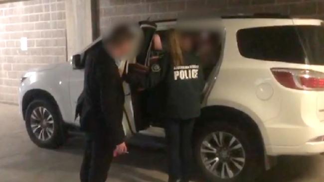 AFP officers arrest Robert Alan Hill, 68, at his Lakemba home over allegations he shared images of child torture and child sexual abuse online. Picture: AFP