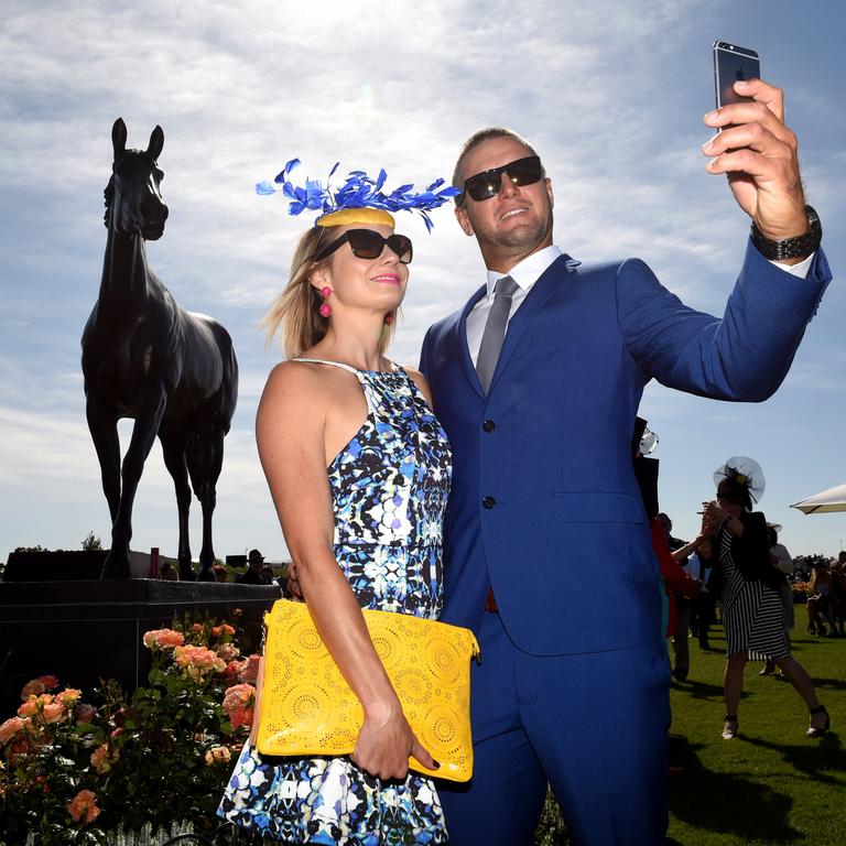 Kate Alcock and Tony Alcock from Queensland take a selfie by the Makybe Diva statue. Picture: Nicole Garmston